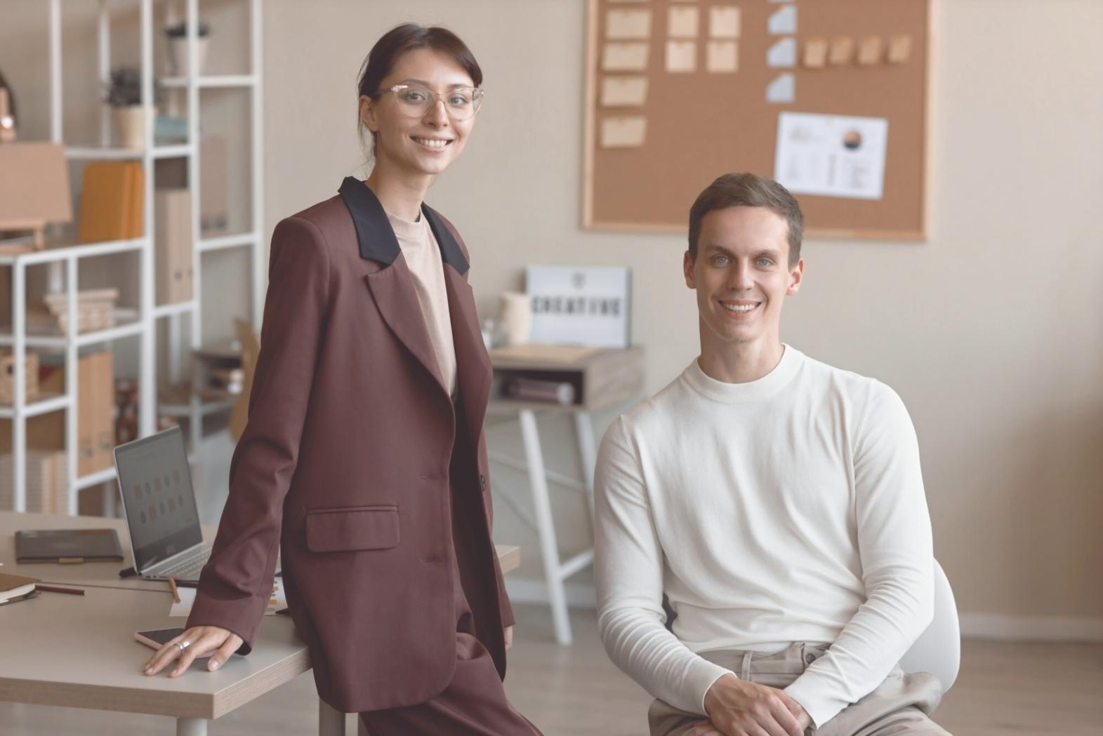 Instructor providing hands-on coding guidance to students